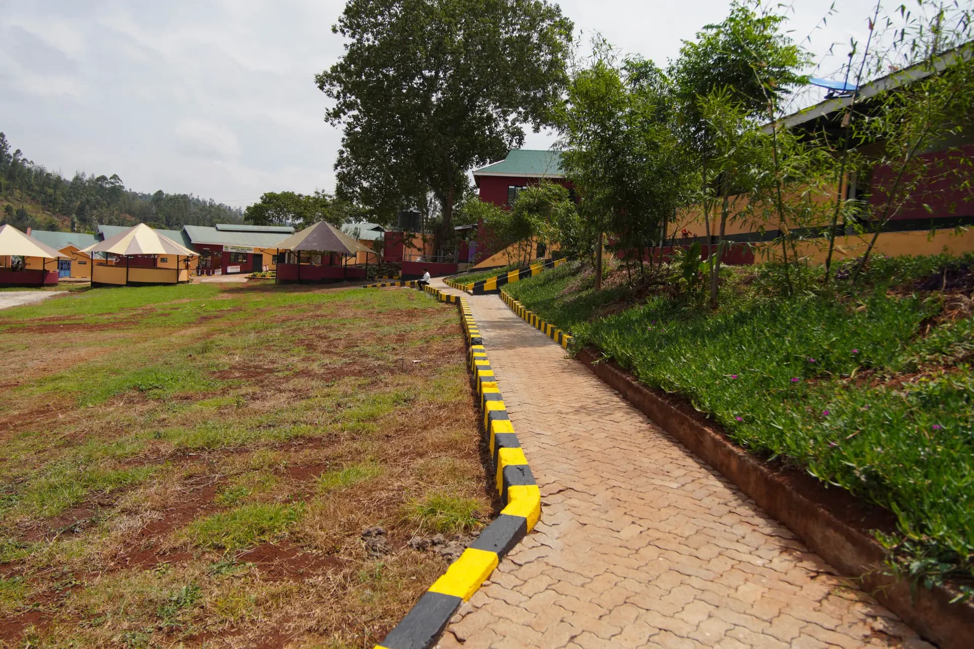 A landscaped walking path and open healing grounds at ARS Mental Wellness Rehabilitation Hospital.